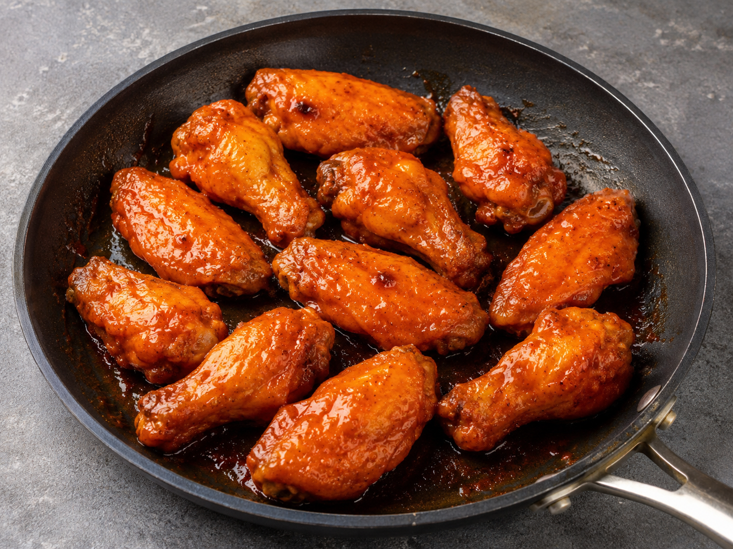 Roasted chicken wings tossed in glossy buffalo hot sauce