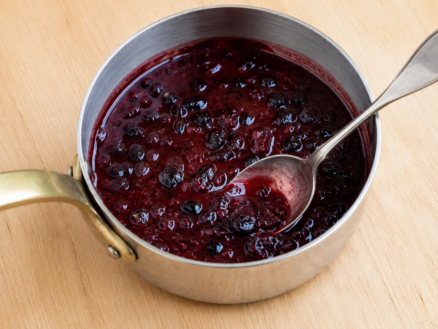 A glossy reddish-brown plum dipping sauce