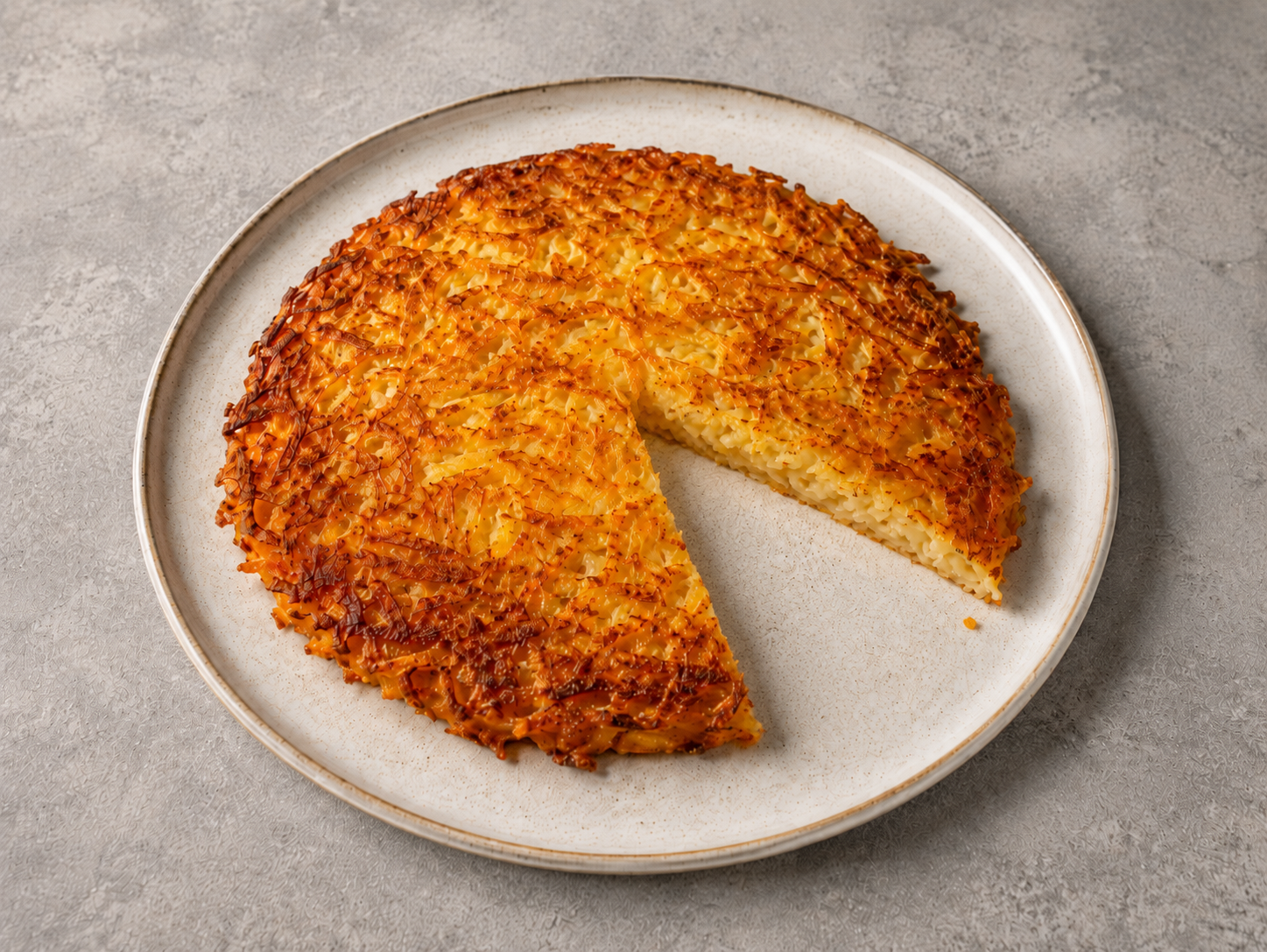 A golden, crispy Swiss rösti potato cake